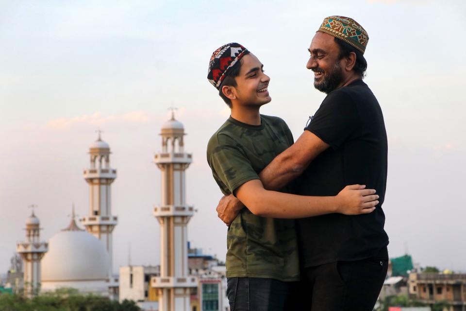 Muslim devotees greet each other on the occassion of Eid-ul-Fitr, near Jama Masjid in Nagpur, FrIday, May 14, 2021.