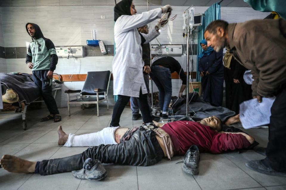 Palestinians receive medical care at Kamal Edwan Hospital in Beit Lahia, in the northern Gaza Strip, after Israeli forces opened fire on an aid truck convoy (AFP via Getty Images)