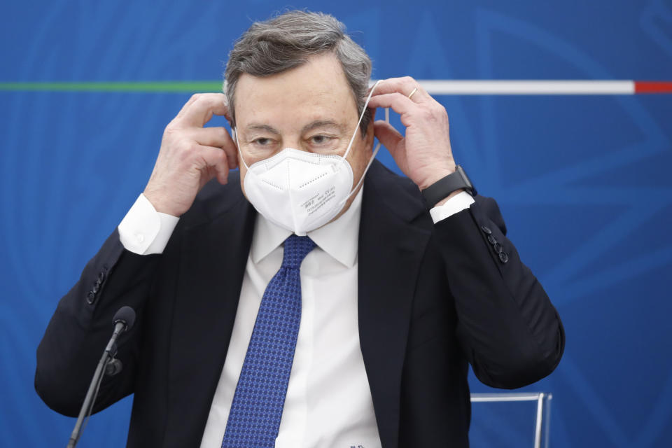 Italian Prime Minister Mario Draghi meets the press, in Rome, Friday, March 26, 2021. (AP Photo/Alessandra Tarantino, pool)