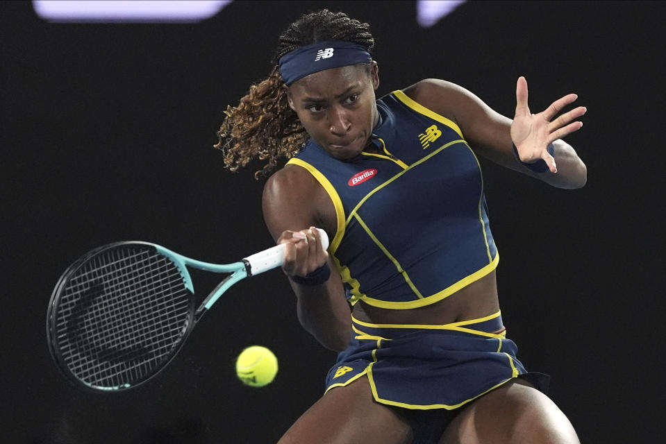 Coco Gauff of the U.S. plays a forehand return to Aryna Sabalenka of Belarus during their semifinal match at the Australian Open tennis championships at Melbourne Park, Melbourne, Australia, Thursday, Jan. 25, 2024. (AP Photo/Andy Wong)