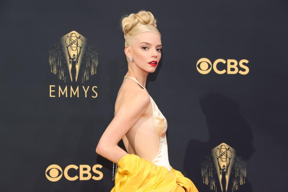 <p>In a breathtaking beauty look, Anya Taylor-Joy nodded to The Queen's Gambit with a crown-like up-do by hairstylist Gregory Russell, and oozed old Hollywood glamour with a true red lip, courtesy of make-up artist Georgie Eisdell using Dior beauty.</p>