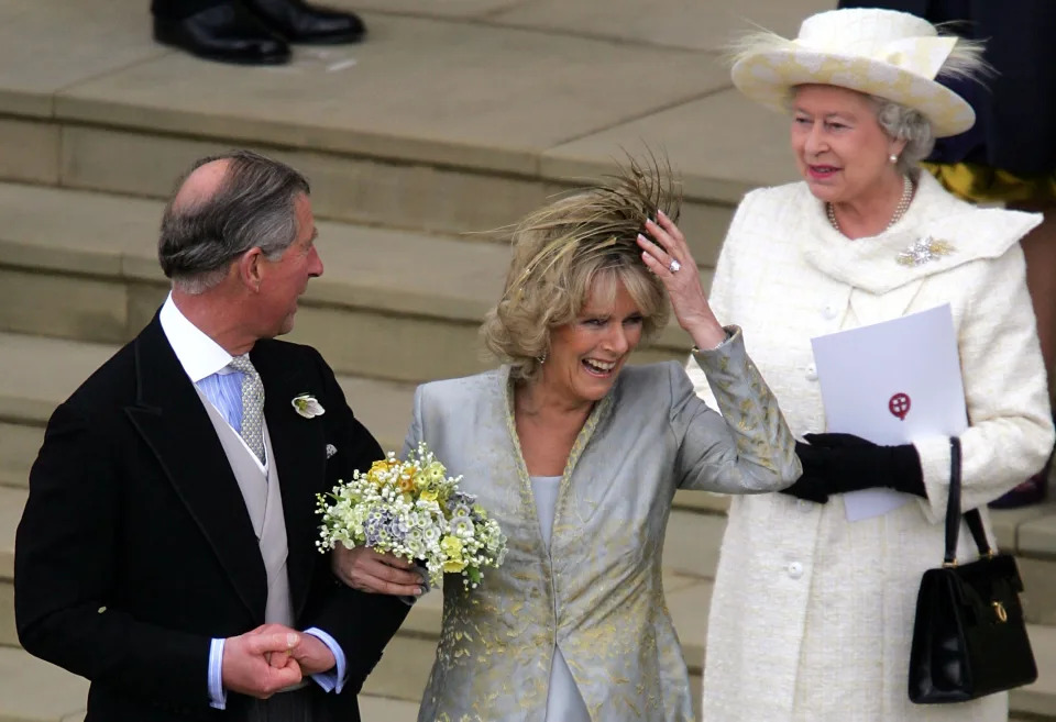 The Queen walking behind Charles and Camilla on their wedding day