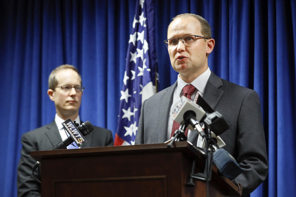 Herb Stapleton, Assistant Special Agent in Charge, FBI, right, speaks alongside U.S. Attorney Benjamin C. Glassman, left, during a news conference, Wednesday, Oct. 10, 2018, in Cincinnati. The Justice Department says a Chinese intelligence operative has been charged with stealing trade secrets from multiple U.S. aviation and aerospace companies. Yanjun Xu was charged Wednesday with conspiring and attempting to commit economic espionage and theft of trade secrets. (AP Photo/John Minchillo)