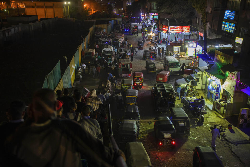 CLARIFIES SECOND AND THIRD SENTENCES -- FILE - In this Nov. 24, 2019 file photo, motorized rickshaws known as tuk-tuks, crowd a street in Cairo, Egypt. On Tuesday, Feb. 11, 2020, the official statistics agency announced Egypt’s fast-growing population hit 100 million people, presenting a pressing problem for an already overburdened country with limited resources. The figure is an increase of 7 million since the publication of the latest census results in 2017. (AP Photo/Nariman El-Mofty, File)