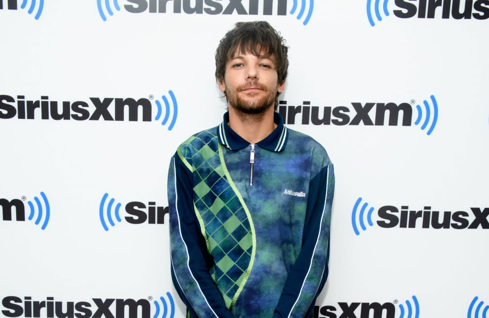 Louis Tomlinson has found his confidence in his solo career and no longer compares himself to his former 1D bandmates credit:Bang Showbiz