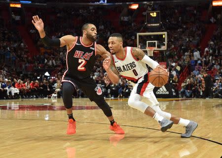 Dec 13, 2017; Miami, FL, USA; Portland Trail Blazers guard Damian Lillard (0) dribbles the ball as Miami Heat guard Wayne Ellington (2) defends during the second half at American Airlines Arena. Steve Mitchell-USA TODAY Sports