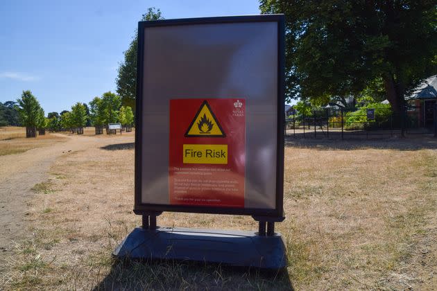  A fire risk sign is seen in a dry Richmond Park as heatwaves and drought conditions caused by climate change continue across the UK. (Photo: SOPA Images via Getty Images)