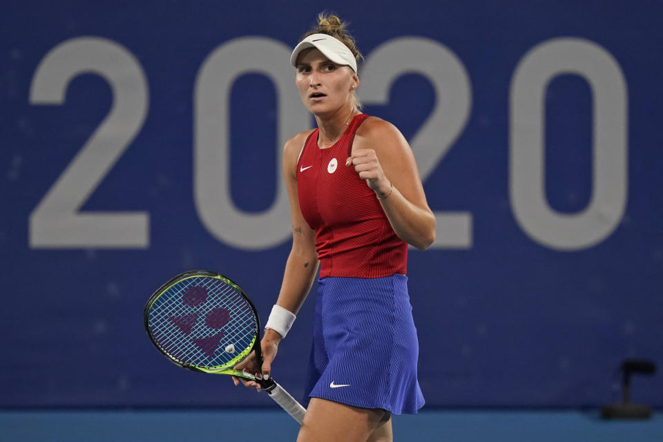 Marketa Vondrousova, of the Czech Republic, reacts after winning a point off Naomi Osaka, of Japan, during the third round of the tennis competition at the 2020 Summer Olympics, Tuesday, July 27, 2021, in Tokyo, Japan. (AP Photo/Seth Wenig)