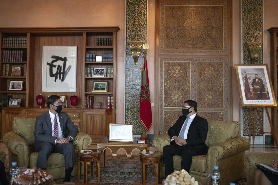 US Secretary of Defense Mark Esper, left, conducts talks with Moroccan Foreign Minister Nasser Bourita, right, in Rabat, Morocco, Friday, Oct. 2, 2020. The visit is part of US Defense Secretary Mark Esper's North Africa tour and is his first visit to Africa as defense secretary. (AP Photo/Mosa'ab Elshamy)