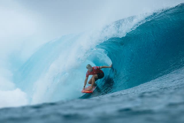 <p>Beatriz Ryder/World Surf League</p> John John Florence surfs in Heat 8 of the Round of 16 at the 2023 Tahiti Pro