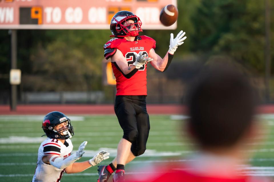 Dover safety Gavin Mullins intercepts a pass intended for South Western tight end Tommy Putman during the first quarter on Friday, September 2, 2022, in Dover. 