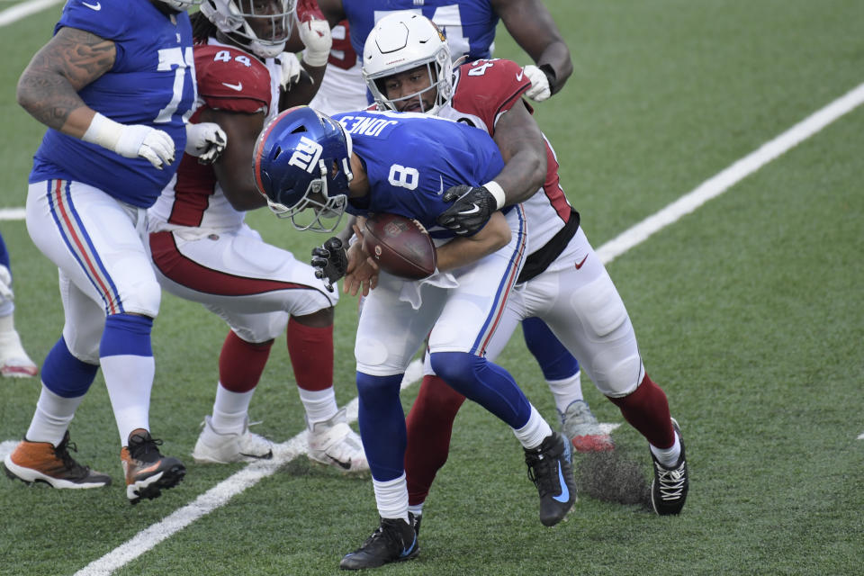 Arizona Cardinals' Haason Reddick, right, knocks the ball loose as he tackled New York Giants quarterback Daniel Jones during the first half of an NFL football game, Sunday, Dec. 13, 2020, in East Rutherford, N.J. (AP Photo/Bill Kostroun)