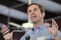 In this Aug. 3, 2019, file photo, Kentucky Democratic candidate for Governor, Attorney General Andy Beshear addresses the audience gathered at the Fancy Farm Picnic in Fancy Farm, Ky. Kentucky's premiere political event — the campaign speeches before raucous partisans at the Fancy Farm picnic — will be silenced this year amid the coronavirus pandemic. This year’s 140th picnic has been scaled back and the Aug. 1, 2020, political speeches were canceled, according to the event's organizers in the Graves County community of Fancy Farm. (AP Photo/Timothy D. Easley, File)