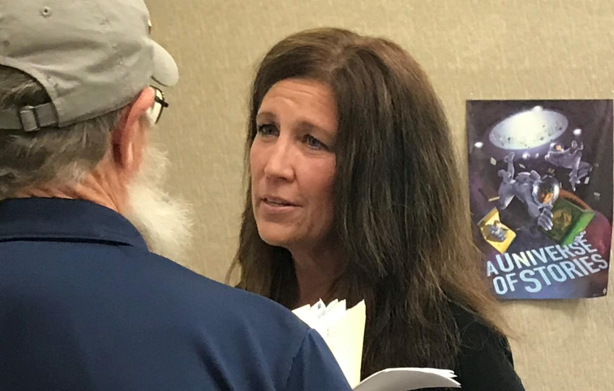 Fairfield Township Trustee Taletha Coles speaks with Fairfield Board President Perry Schnarr after the board meeting on Tuesday, June 14, 2022.