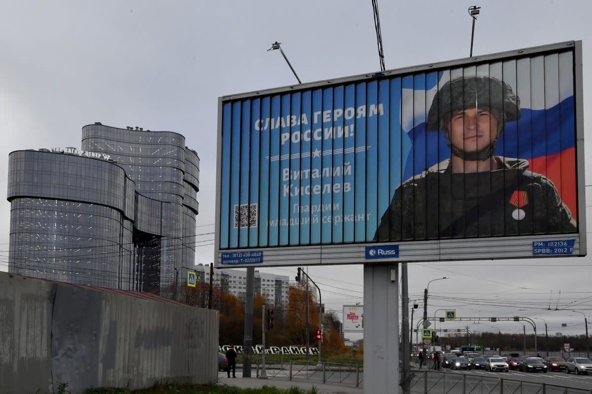 A poster of a Russian soldier with a slogan reading ‘Glory to the heroes of Russia’ opposite the PMC Wagner Centre in St Petersburg (AFP/Getty)