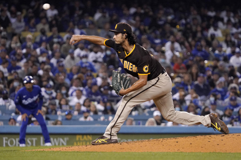 FILE-San Diego Padres starting pitcher Yu Darvish throws to the plate during the third inning of a baseball game against the Los Angeles Dodgers Tuesday, Sept. 28, 2021, in Los Angeles. (AP Photo/Mark J. Terrill, File)