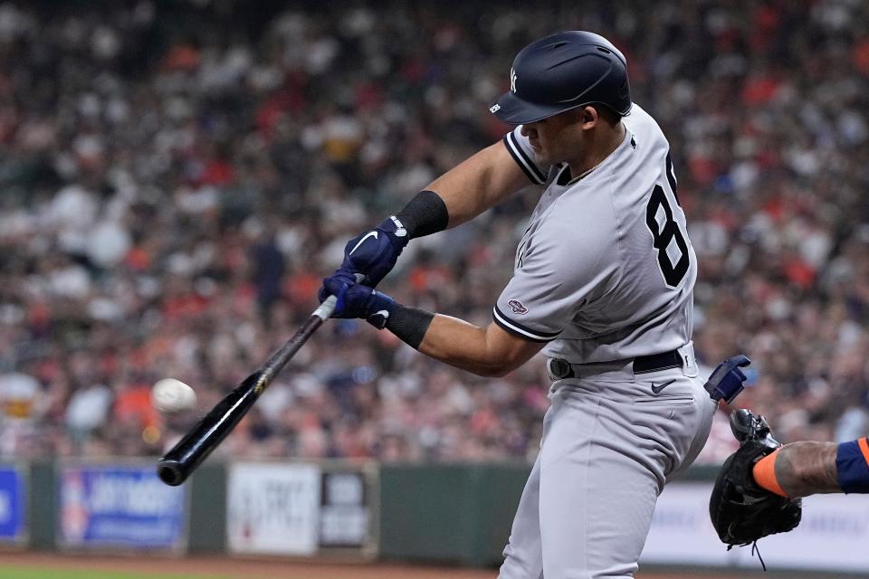 New York Yankees' Jasson Dominguez, in his first at-bat in the majors, hits a two-run home run against the Houston Astros during the first inning of a baseball game Friday, Sept. 1, 2023, in Houston. (AP Photo/Kevin M. Cox)