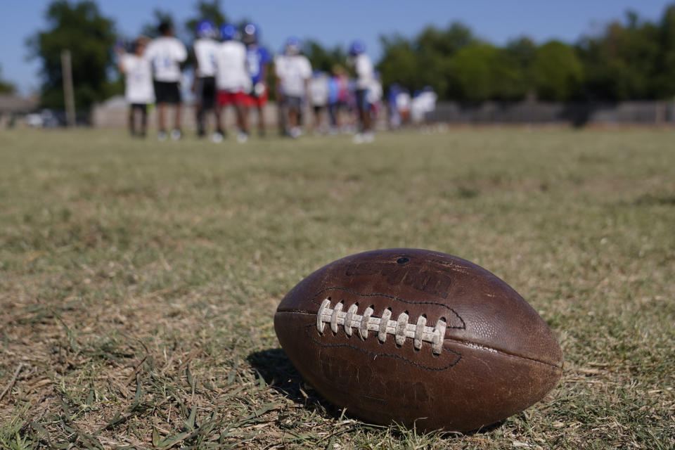 A middle school football team practices Wednesday, Sept. 28, 2022, in Oklahoma City. Oklahoma has a new law that bans public elementary, middle school, high school and college athletes from competing on the sports teams of their gender identity if it is different from their sex assigned at birth. While more than a dozen other states have similar laws, Oklahoma is believed to be the only one known to require a “biological sex affidavit” for participation. (AP Photo/Sue Ogrocki)