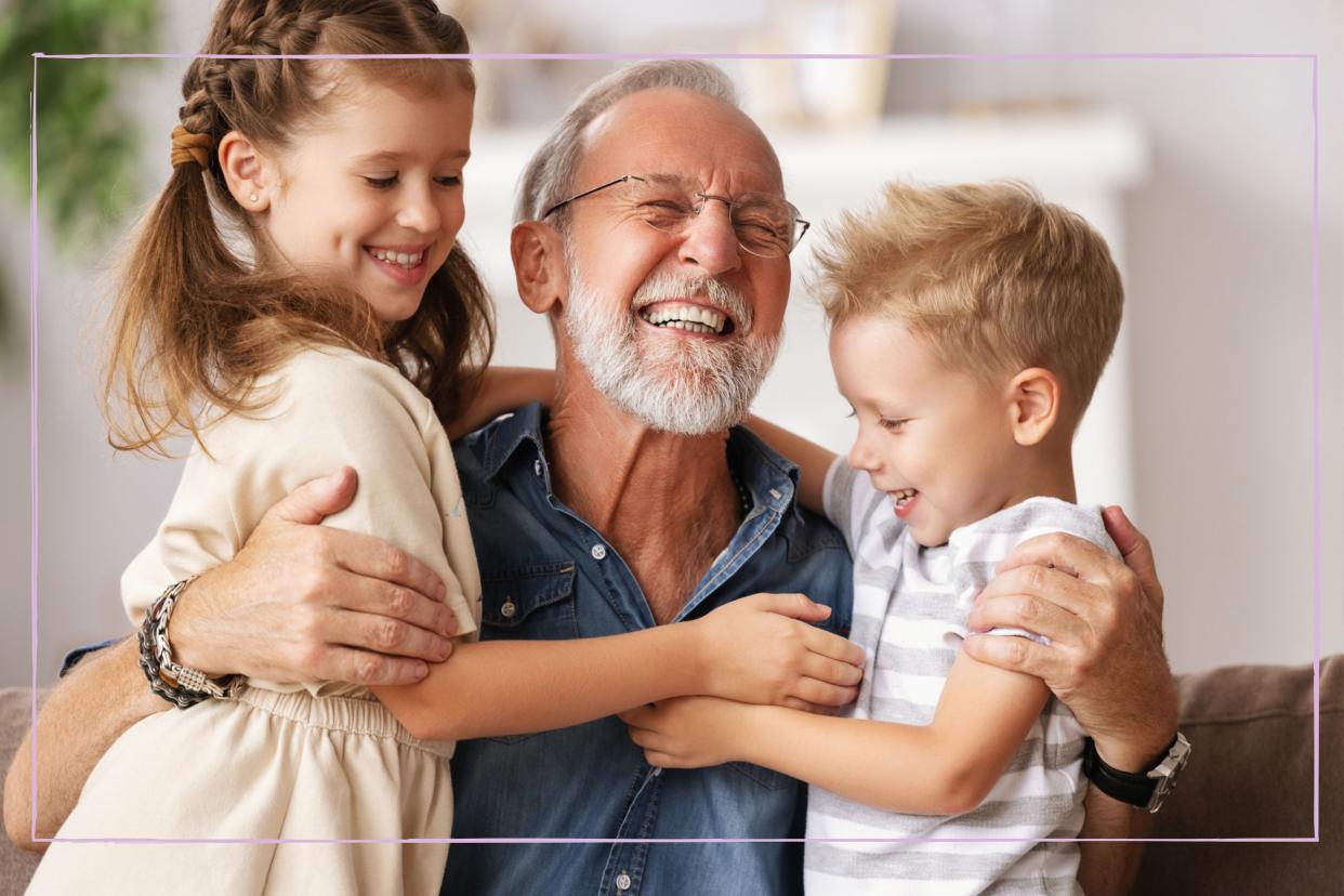  Grandfather hugging grandchildren. 