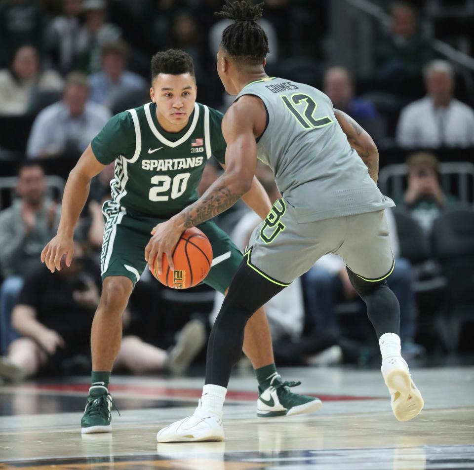 Michigan State guard Nick Sanders guards Baylor guard Dantwan Grimes during the second half of MSU's 88-64 win over Baylor on Saturday, Dec.16, 2023, at Little Caesars Arena.