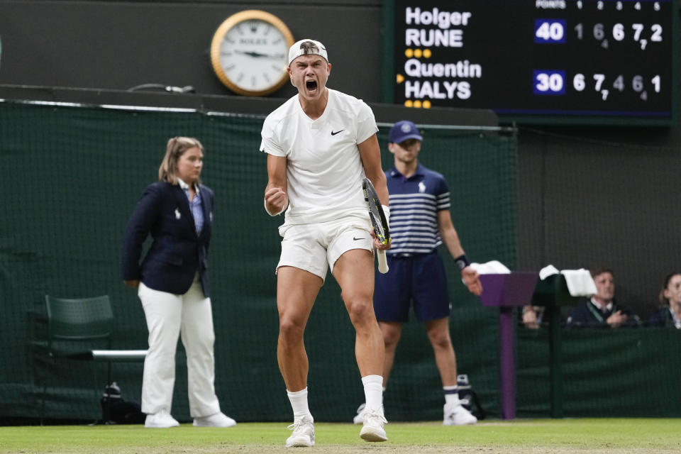 Holger Rune of Denmark reacts after winning a point against Quentin Halys France during their third round match at the Wimbledon tennis championships in London, Saturday, July 6, 2024. (AP Photo/Alberto Pezzali)