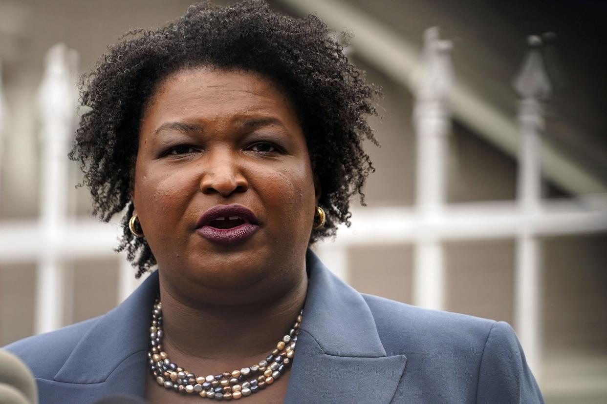 Georgia Democratic gubernatorial candidate Stacey Abrams talks to the media during Georgia's primary election on Tuesday, May 24, 2022, in Atlanta. 
