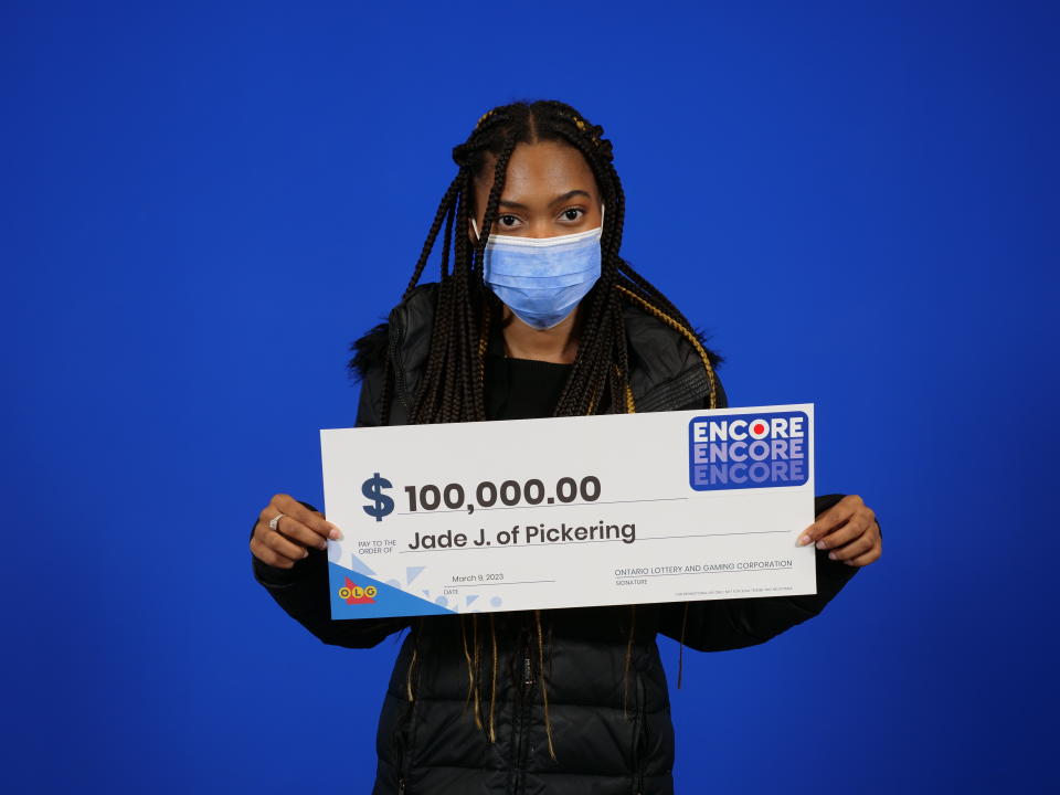 Jade Jenkins holding a ENCORE lottery check worth $100,000. (Courtesy: OLG)