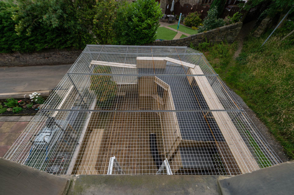 The cage for Sue Haworth's cats in Huddersfield, West Yorkshire (Picture: SWNS)