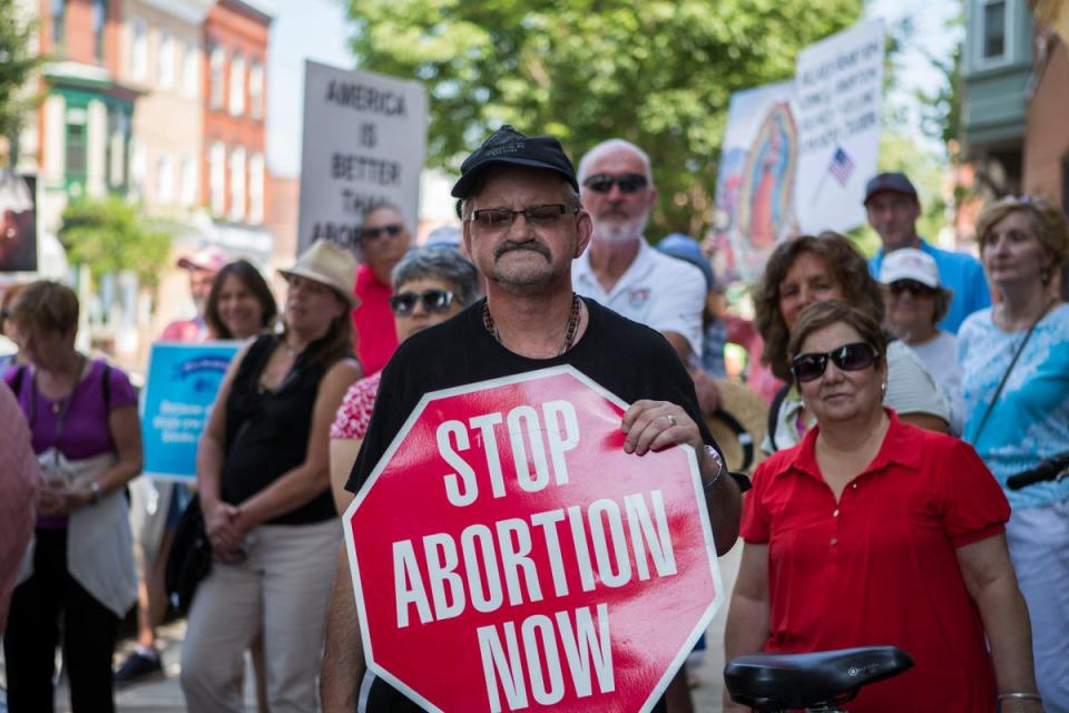 Anti-abortion activists hold a rally outside Gosnell’s shuttered clinic in 2016 (Getty Images)