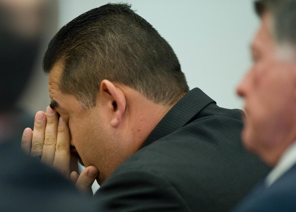 Former Fullerton police officer Manuel Ramos reacts as the not guilty verdict is read in the Kelly Thomas murder trial in Santa Ana