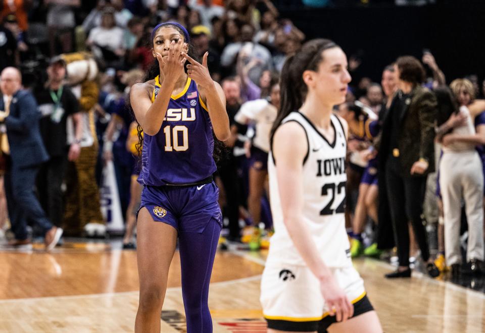 Angel Reese of the LSU Lady Tigers and Caitlin Clark of the Iowa Hawkeyes towards the end of the 2023 NCAA Women's Basketball Tournament National Championship on April 2, 2023