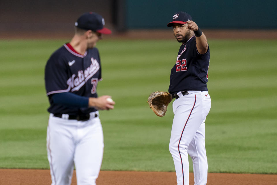 Washington Nationals first baseman Dominic Smith, right, celebrates with starting pitcher Jackson Rutledge after a double play hit into by Chicago White Sox's Elvis Andrus during the fifth inning of a baseball game Tuesday, Sept. 19, 2023, in Washington. (AP Photo/Stephanie Scarbrough)