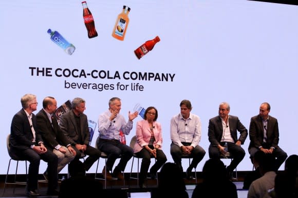 Senior leadership of Coca-Cola on stage, answering questions at the company's 2017 investor day conference.