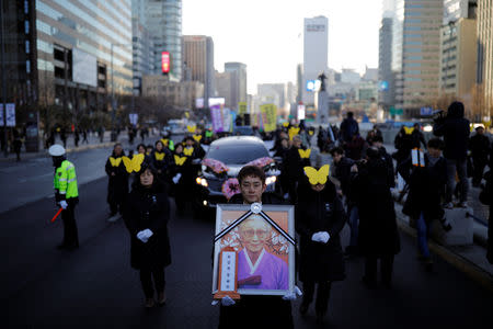 People march during the funeral of a former South Korean "comfort woman" Kim Bok-dong in Seoul, South Korea, February 1, 2019. REUTERS/Kim Hong-Ji