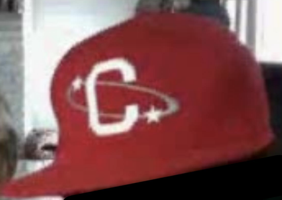 A red cap with a white logo featuring the letter C.