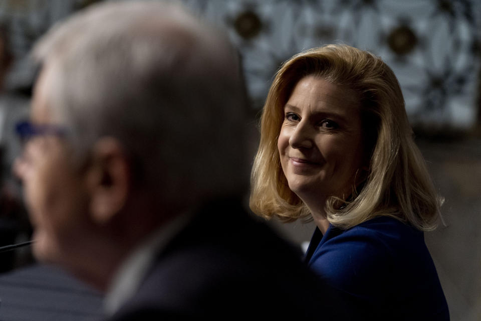 Nominee to be Secretary of the Army Christine Elizabeth Wormuth smiles as former Secretary of Defense Chuck Hagel, left, introduces her during a Senate Armed Services Committee nomination hearing on Capitol Hill in Washington, Thursday, May 13, 2021. (AP Photo/Andrew Harnik)