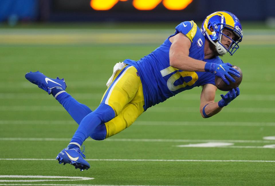 Cooper Kupp won the receiving triple crown in 2021, leading the league in yards (1,947), receptions (147) and touchdowns (16).