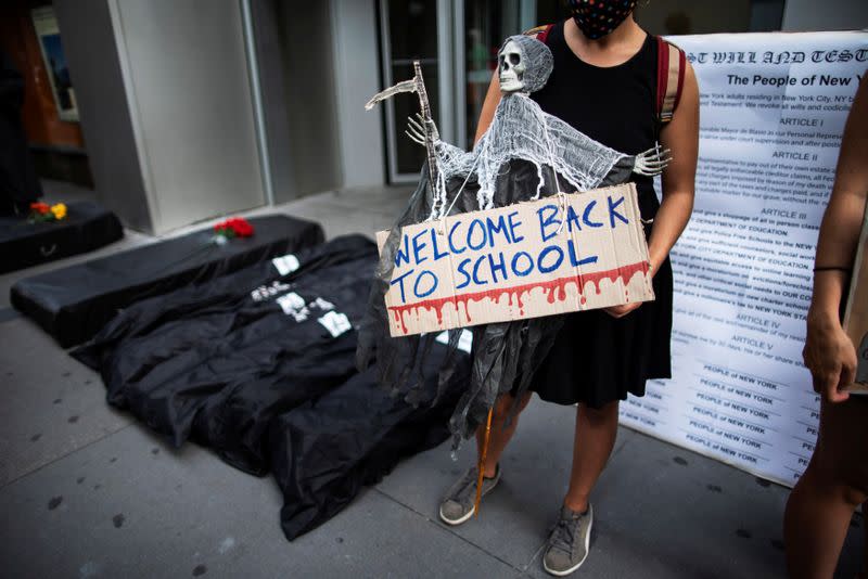 Fake morgue bags are seen near the entrance of United Federation of Teachers as symbol of students dead by the coronavirus disease (COVID-19) as people take part in a march and rally during the National Day of Resistance to schools re-opening in New York