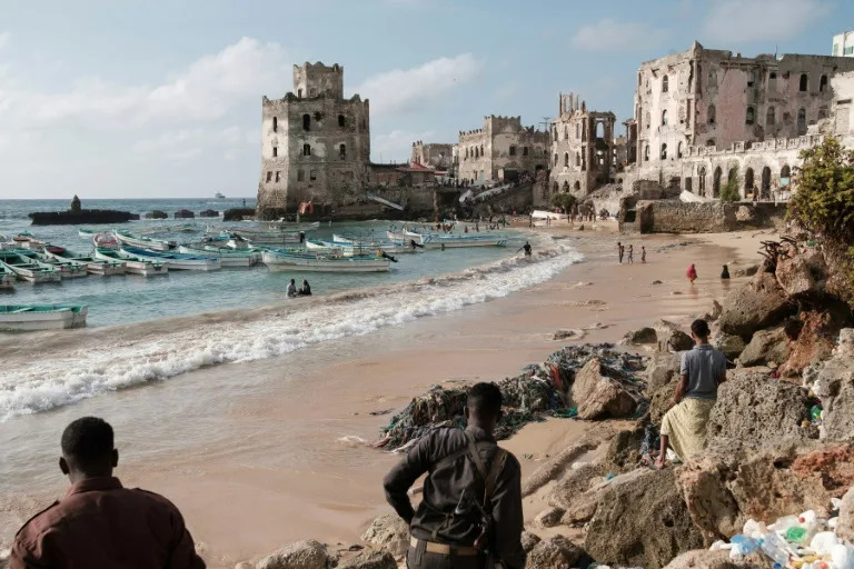 An old lighthouse stands guard over a fishing beach in the Somali capital Mogadishu (GUY PETERSON)