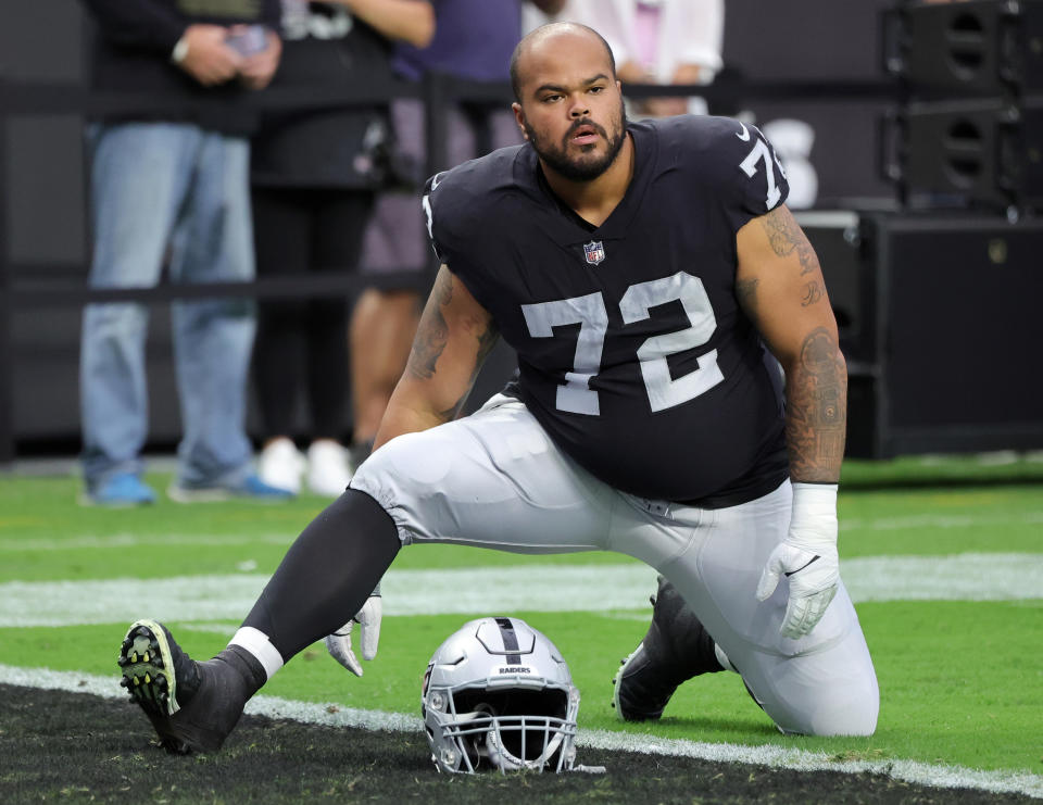 LAS VEGAS, NEVADA – AUGUST 26: Guard Jermaine Eluemunor #72 of the Las Vegas Raiders stretches as he warms up before a preseason game against the <a class="link " href="https://sports.yahoo.com/nfl/teams/new-england/" data-i13n="sec:content-canvas;subsec:anchor_text;elm:context_link" data-ylk="slk:New England Patriots;sec:content-canvas;subsec:anchor_text;elm:context_link;itc:0">New England Patriots</a> at Allegiant Stadium on August 26, 2022 in Las Vegas, Nevada. The Raiders defeated the Patriots 23-6. (Photo by Ethan Miller/Getty Images)