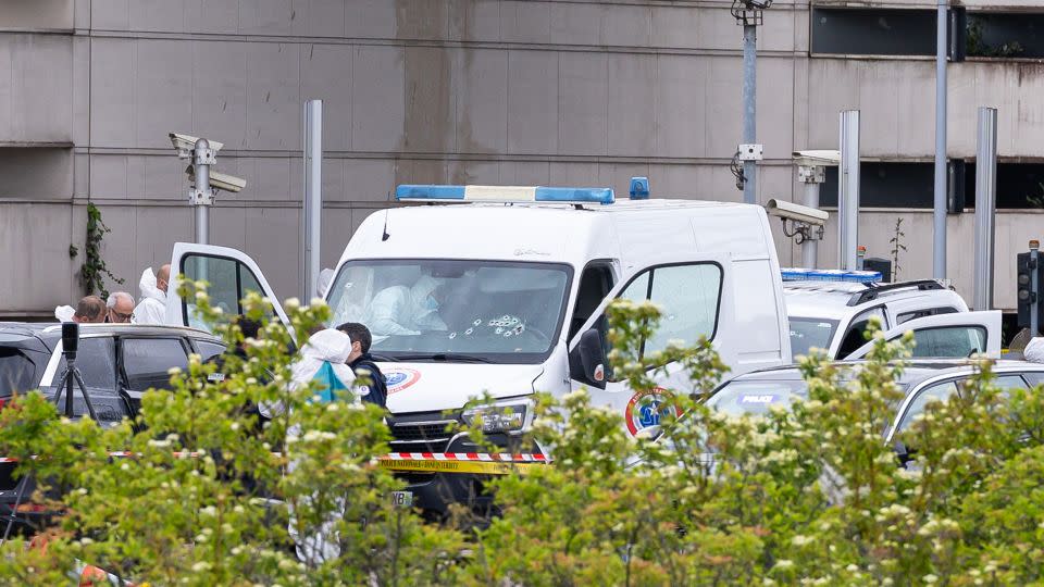 French forensic police inspect a vehicle at Incarville toll station, where gunmen ambushed a prison van. - Christophe Petit Tesson/EPA-EFE/Shutterstock