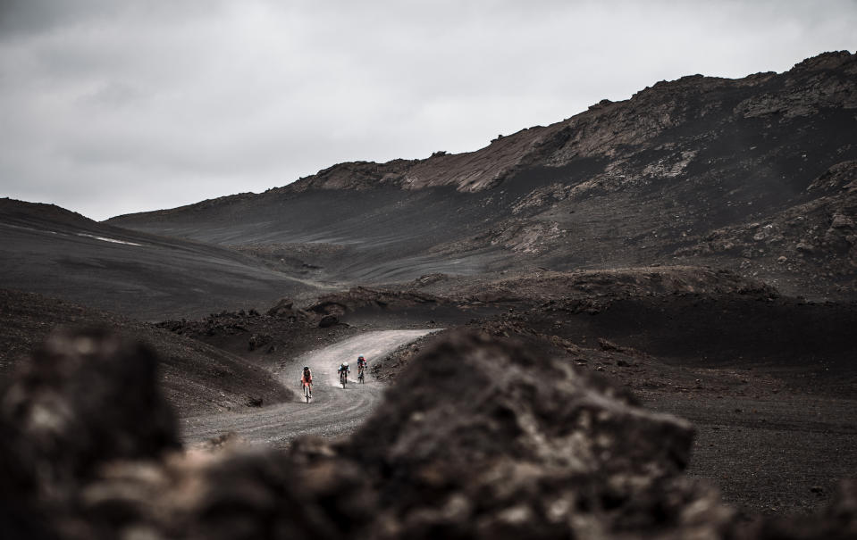 Riders pass through the highlands of Iceland on lava roads