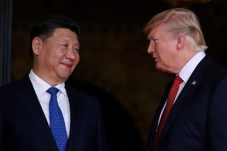 U.S. President Donald Trump welcomes Chinese President Xi Jinping at Mar-a-Lago state in Palm Beach, Florida, U.S., April 6, 2017. REUTERS/Carlos Barria/Files