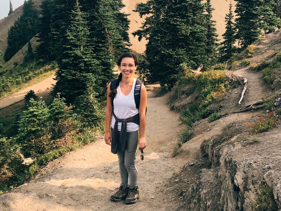 the writer Hiking in the Olympic Mountains surrouned by trees