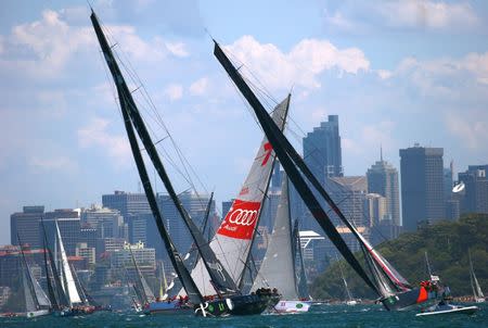 The yacht Wild Oats XI (C) sails behind other entrants Perpetual Loyal and Scallywag (R) on Sydney Harbour during the start of the annual Sydney to Hobart Yacht race, Australia's premiere bluewater classic, in Australia, December 26, 2016. REUTERS/David Gray