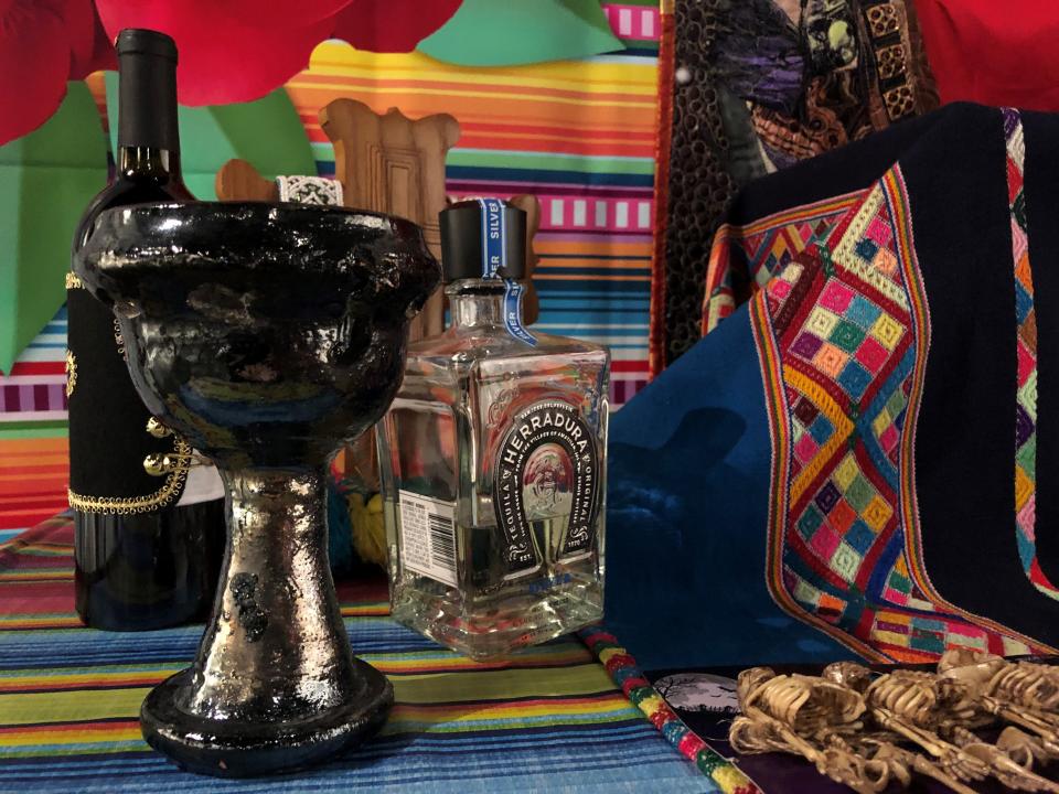 A Dia de los Muertos ofrenda includes food and drinks for dead loved ones, often their favorite alcohol.