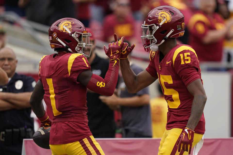 Southern California wide receiver Zachariah Branch (1) celebrates his touchdown with wide receiver Dorian Singer (15) during the first half of an NCAA college football game against Nevada, Saturday, Sept. 2, 2023, in Los Angeles. (AP Photo/Ryan Sun)