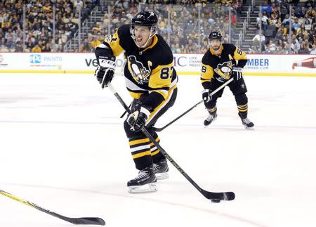 Oct 14, 2017; Pittsburgh, PA, USA; Pittsburgh Penguins center Sidney Crosby (87) shoots the puck against the Florida Panthers during the third period at PPG PAINTS Arena. The Penguins won 4-3. Mandatory Credit: Charles LeClaire-USA TODAY Sports