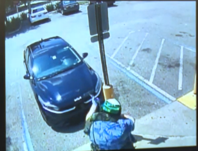 Dollar General store security video captured this image of Ryan Palmeter firing into the car of his first victim in a hate-filled shooting rampage in Jacksonville on Aug. 26, according to the Sheriff's Office.