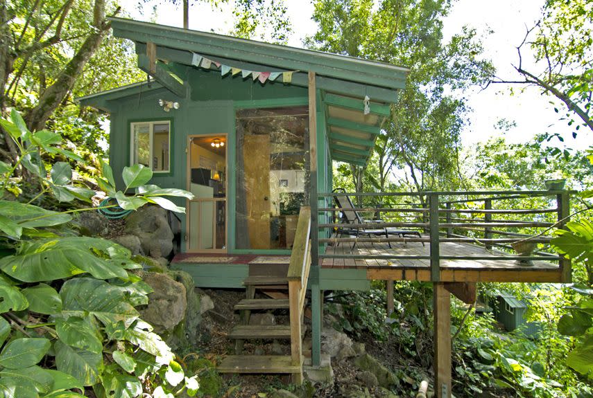 <p>Set in a lush tropical paradise, the 250-square-foot Sunset Beach Treehouse Bungalow in Haleiwa, Hawaii overlooks one of the North Shore's most famous surf spots. Renters climb a 100-step stone path to reach the structure, nestled among black lava rocks and a leafy canopy of Banyan, avocado, and mango trees. Featuring a full-size bed as well as a lofted sleeping area, the treehouse sleeps as many as three people, and includes a kitchenette and bathroom. Rental rates start from $1,200 per week. </p><p><a class="link " href="https://go.redirectingat.com?id=74968X1596630&url=https%3A%2F%2Fwww.airbnb.com%2Frooms%2F38944&sref=https%3A%2F%2Fwww.countryliving.com%2Fhome-design%2Fg1887%2Ftiny-house%2F" rel="nofollow noopener" target="_blank" data-ylk="slk:PLAN YOUR TRIP;elm:context_link;itc:0;sec:content-canvas">PLAN YOUR TRIP</a></p>